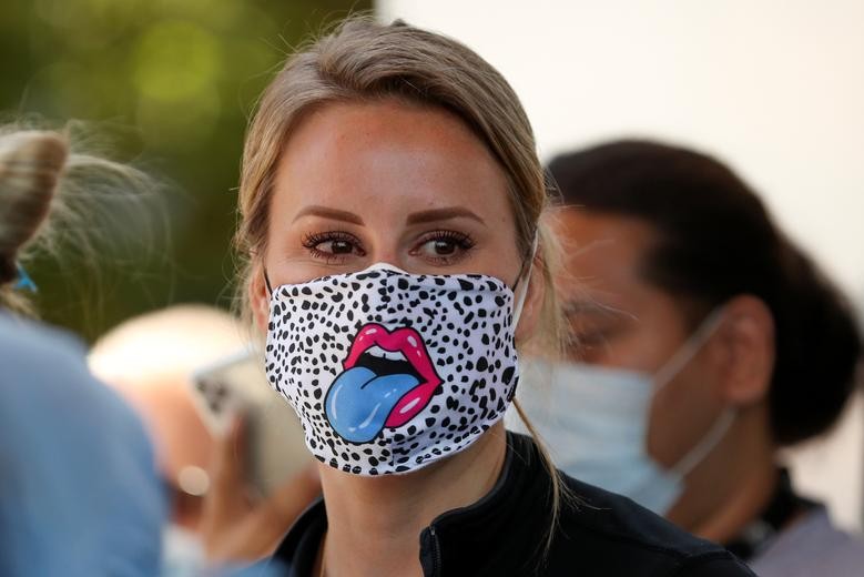 A nurse at St. Joseph's Hospital wears a unique mask as the hospital celebrates the release of a COVID-19 patient after 45 days in their care in Orange, California. REUTERS/Mike Blake